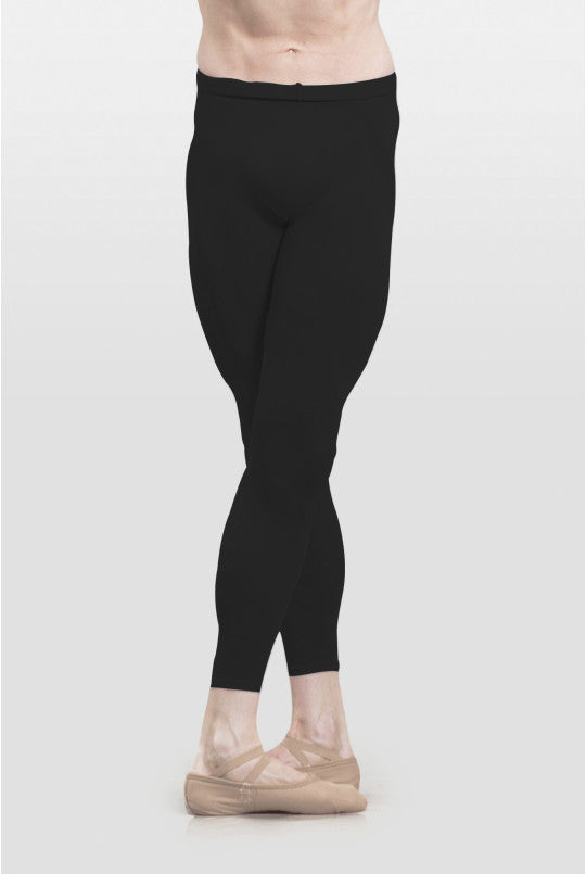 Person wearing black leggings on a white background