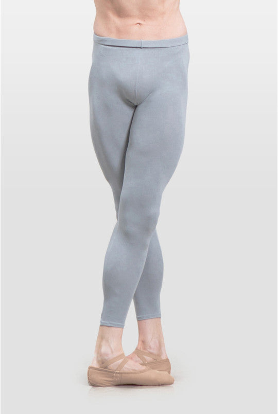 Person wearing light gray leggings on a white background