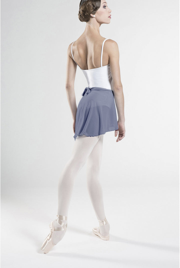 Ballerina in a white top and blue skirt on a white background