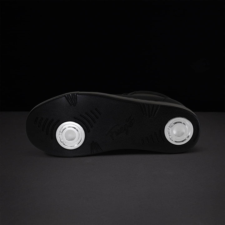 Black shoe sole with white circular designs on a dark background