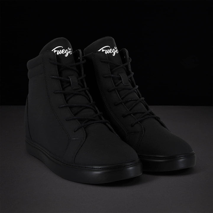 Pair of black high-top sneakers with white logo on a dark background