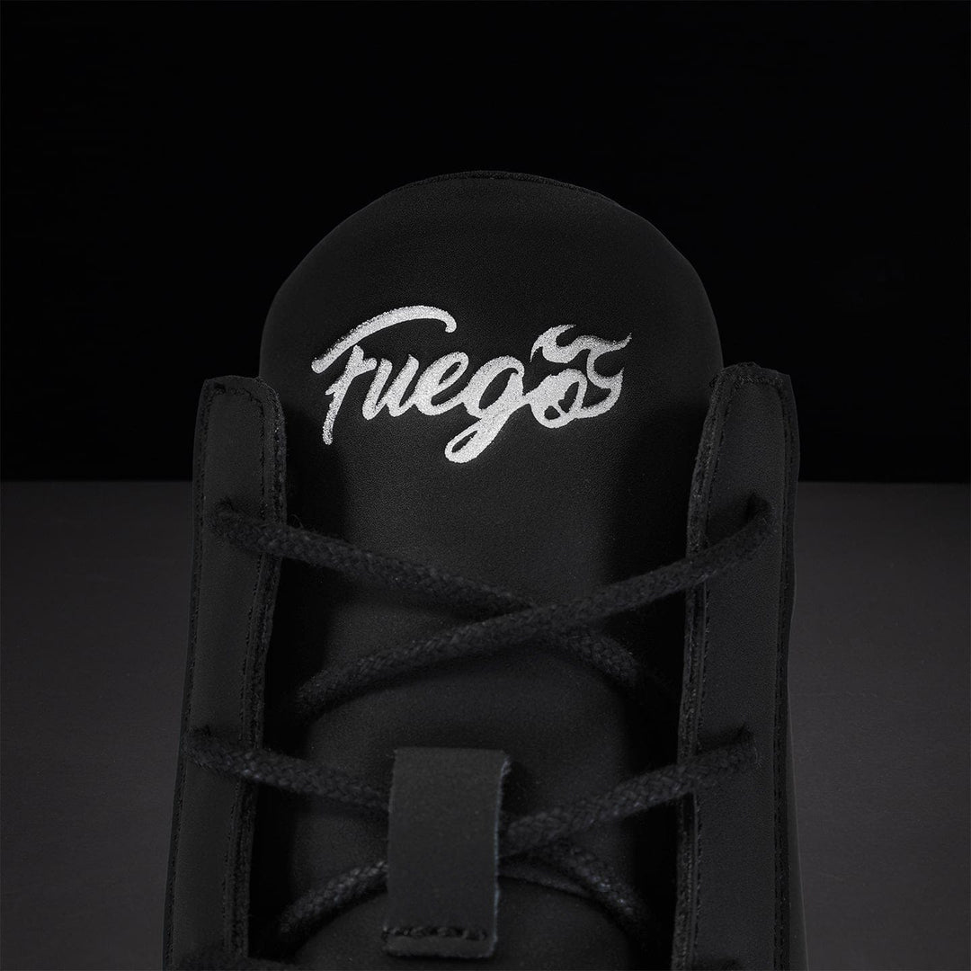 Black sneaker with white 'Fuego' logo on the back against a dark background.