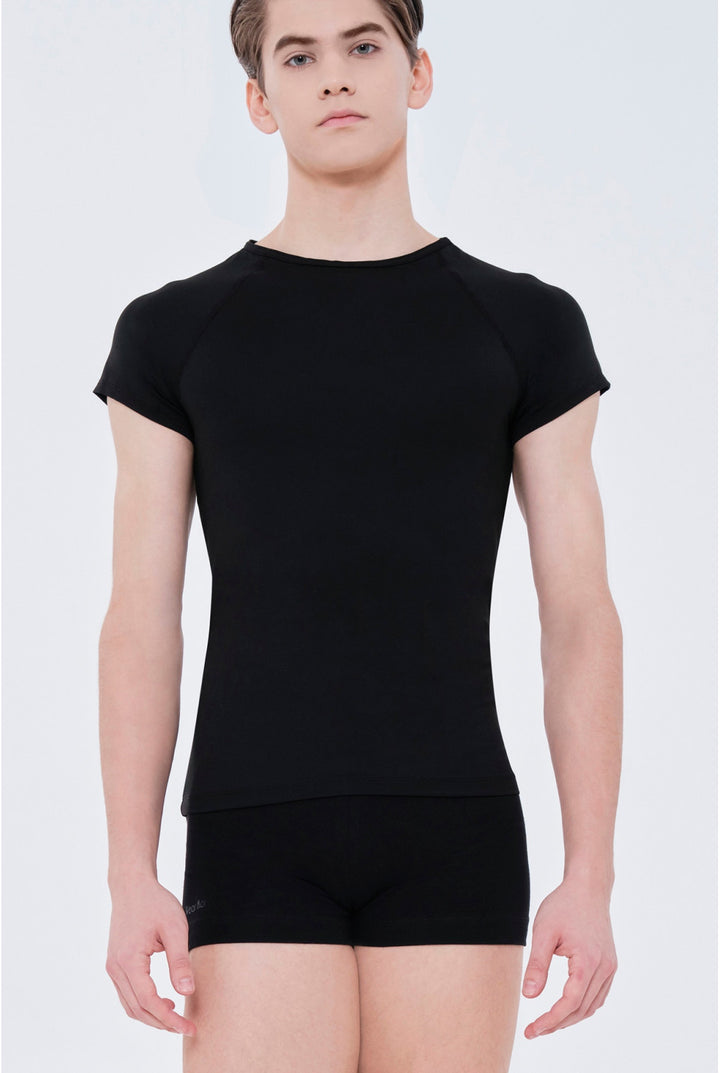 Person wearing a black t-shirt and black shorts on a white background