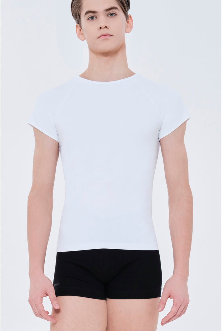 A male model wearing a fitted white short-sleeve crewneck t-shirt and black boxer briefs, photographed against a clean light gray studio background.