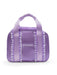 Purple bag with ruffles and 'Capezio' branding on a white background
