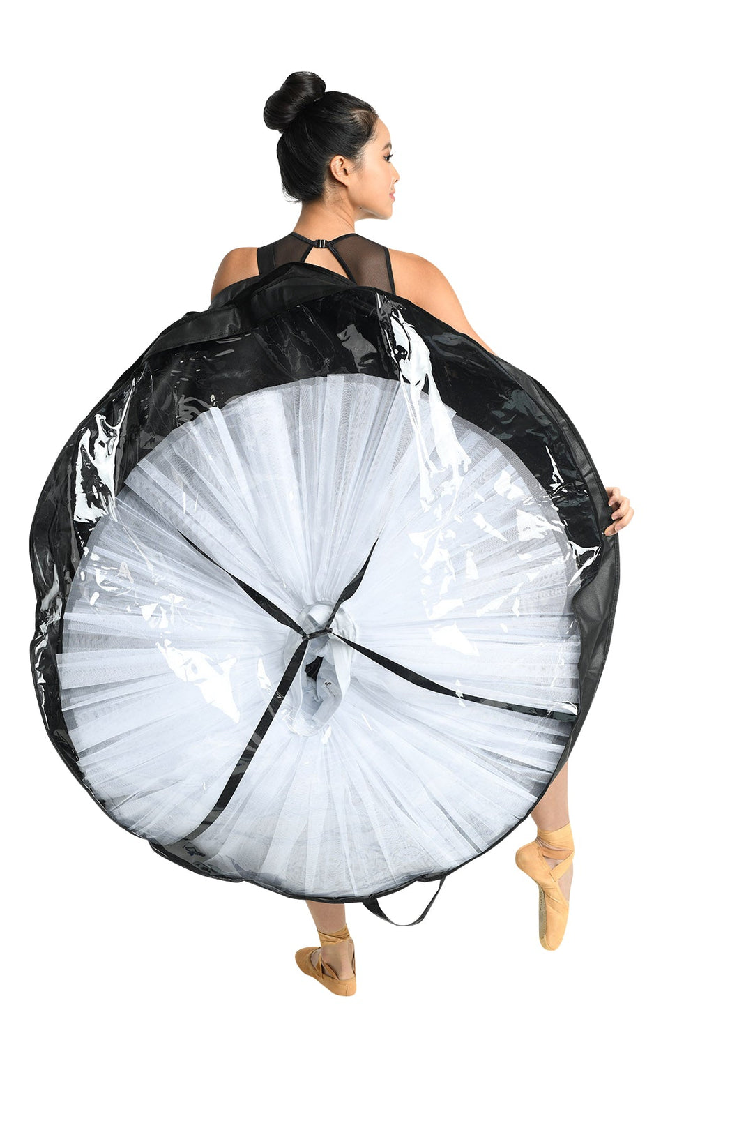 Person holding a large white hoop with black accents on a white background