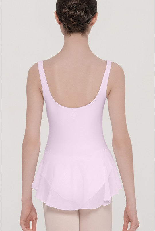 Person wearing a light pink leotard against a plain background