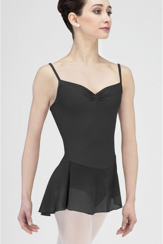 Woman wearing a black ballet dress on a white background
