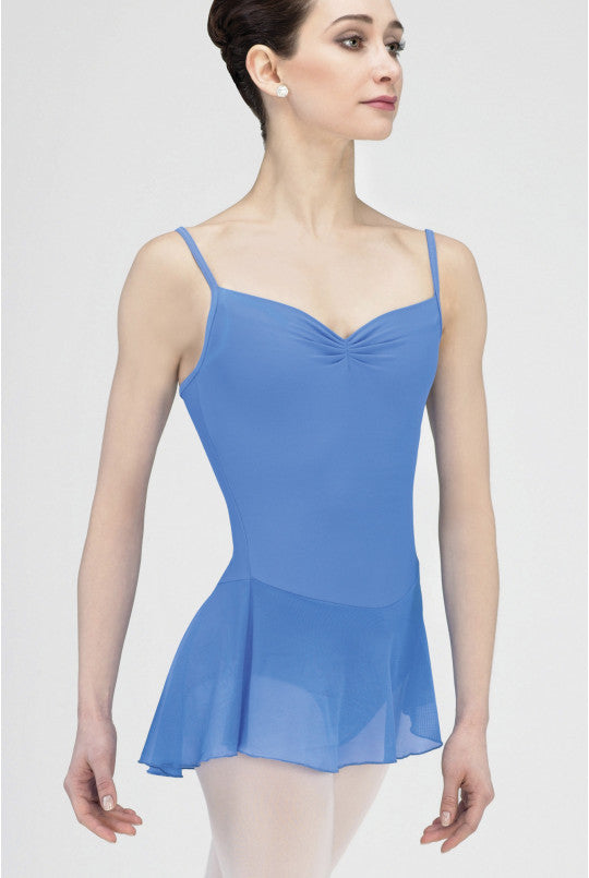Woman wearing a french blue leotard with a white background