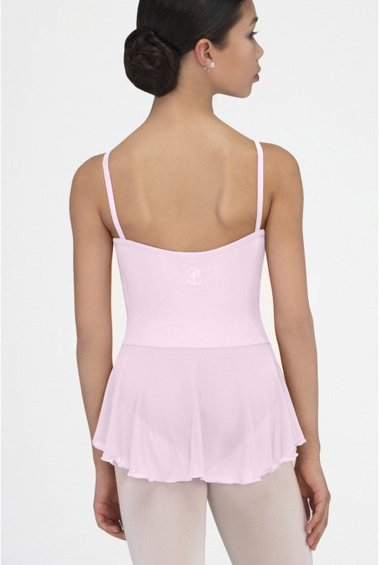 Woman wearing a pink camisole against a white background