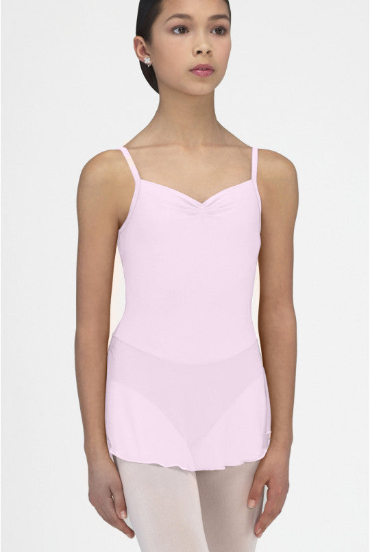 Woman wearing a pink camisole against a white background