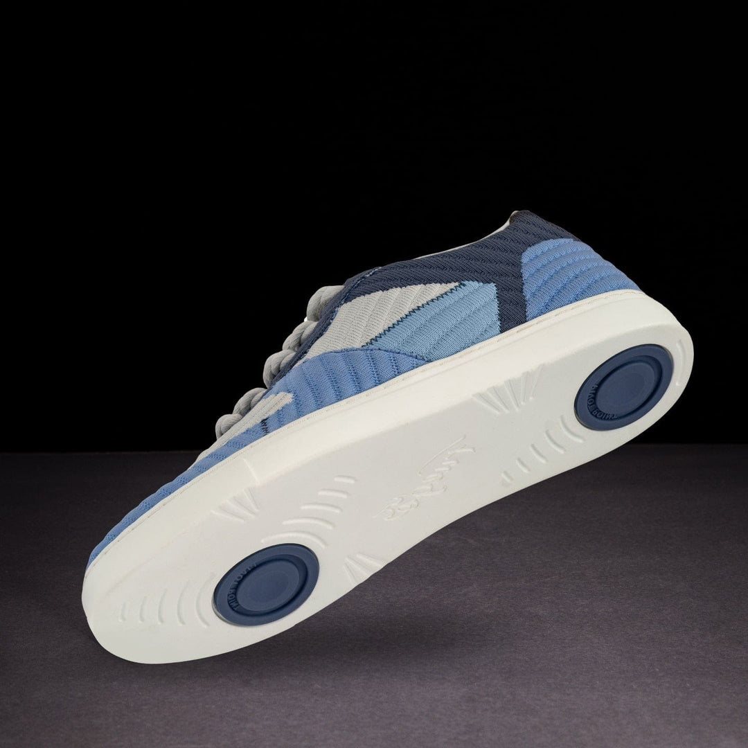 Blue and white sneaker on a dark background