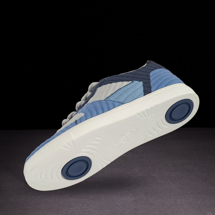 Blue and white sneaker on a dark background