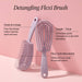 Detangling Flexi Brush with features highlighted on a pink background