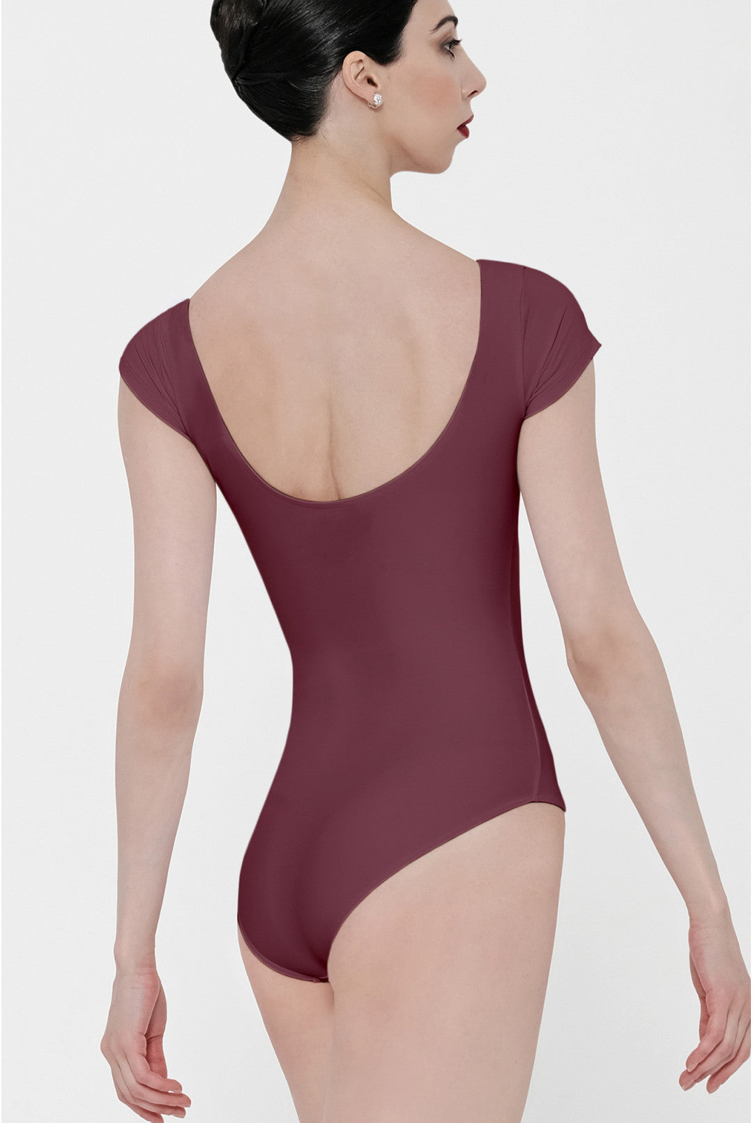 A woman shown from the back wearing a sleeveless leotard with a wide scoop neckline and cap sleeves, in a solid burgundy color, against a light gray studio background.