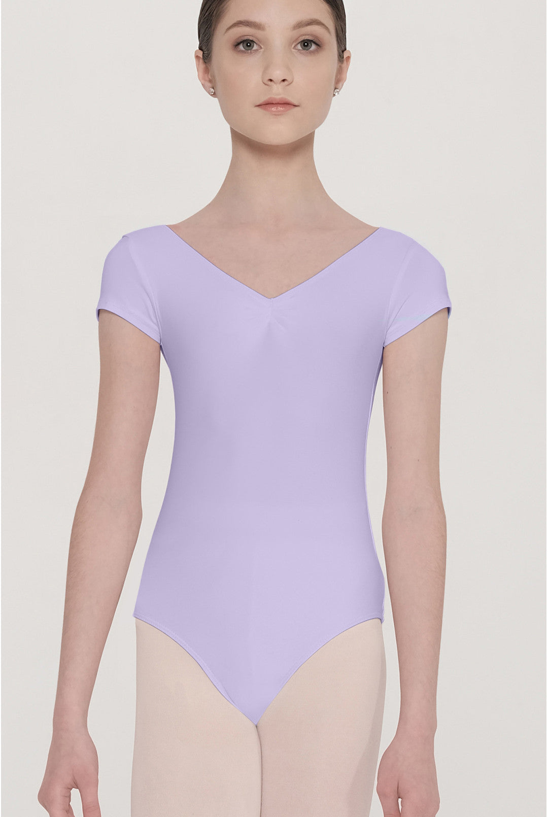 Person wearing a light purple leotard on a plain background