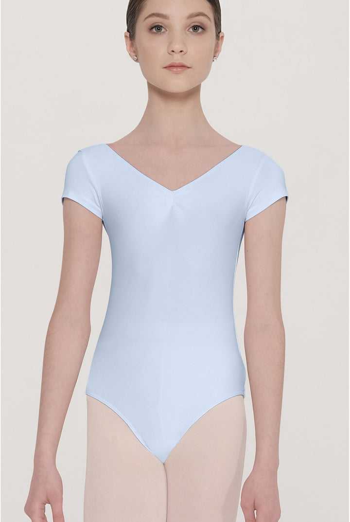 Person wearing a light blue leotard against a plain background