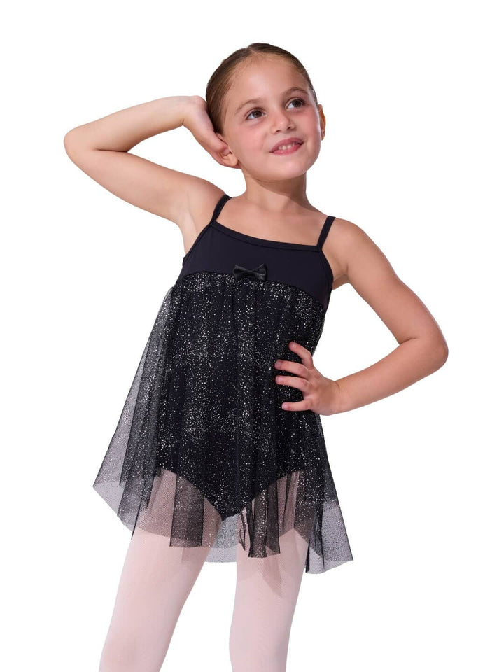Young girl wearing a black sparkly dress on a white background