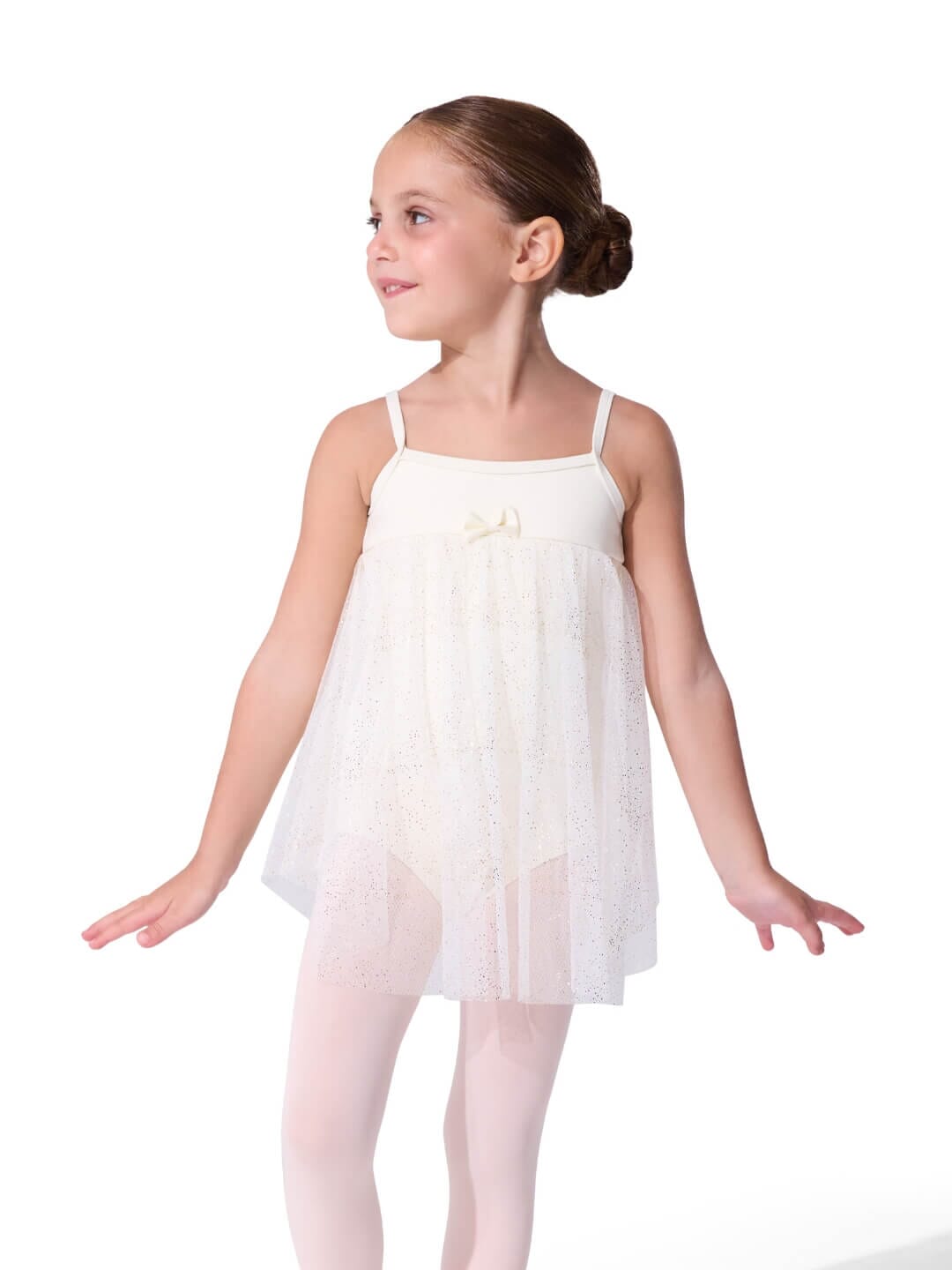 Young girl wearing a white ballet dress on a white background