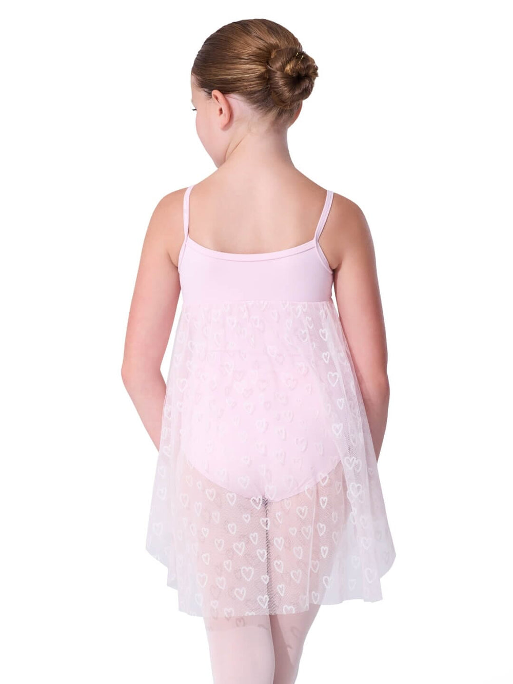 Young girl wearing a light pink floral dress on a white background