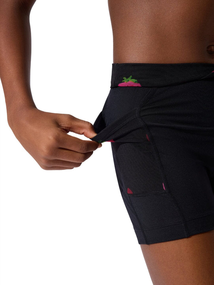 Black athletic shorts with pink accents on a white background