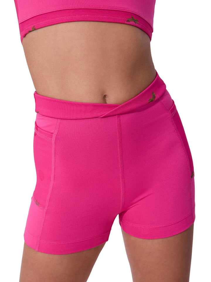Bright pink athletic shorts on a white background