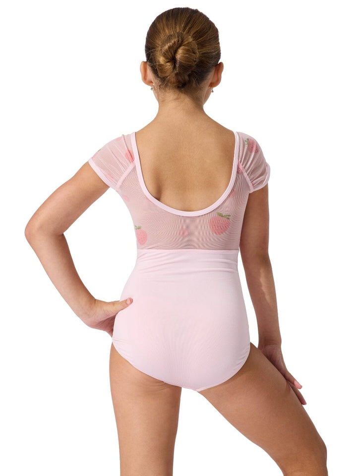 Person wearing a pink ballet leotard on a white background