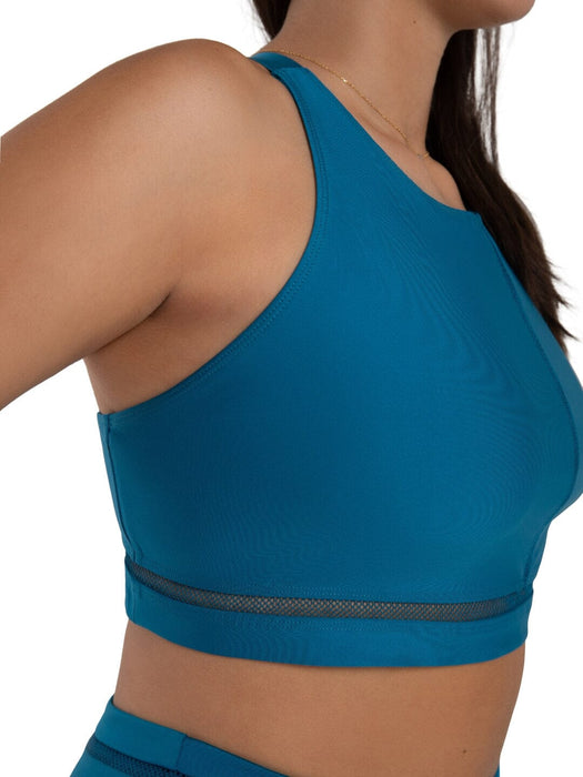 Blue sports bra with mesh detail on a white background