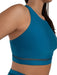 Blue sports bra with mesh detail on a white background