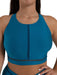 Teal sports bra with mesh panels on a white background