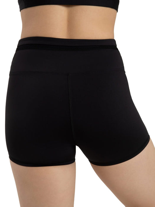Black athletic shorts worn by a person on a white background