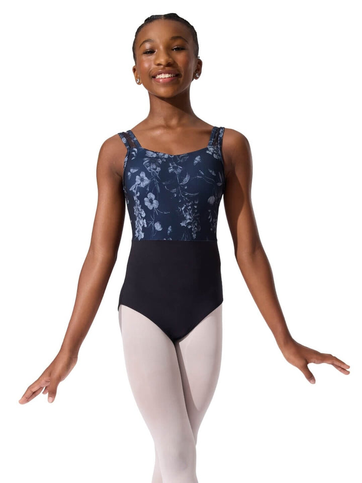 Ballerina wearing a floral-patterned leotard on a white background