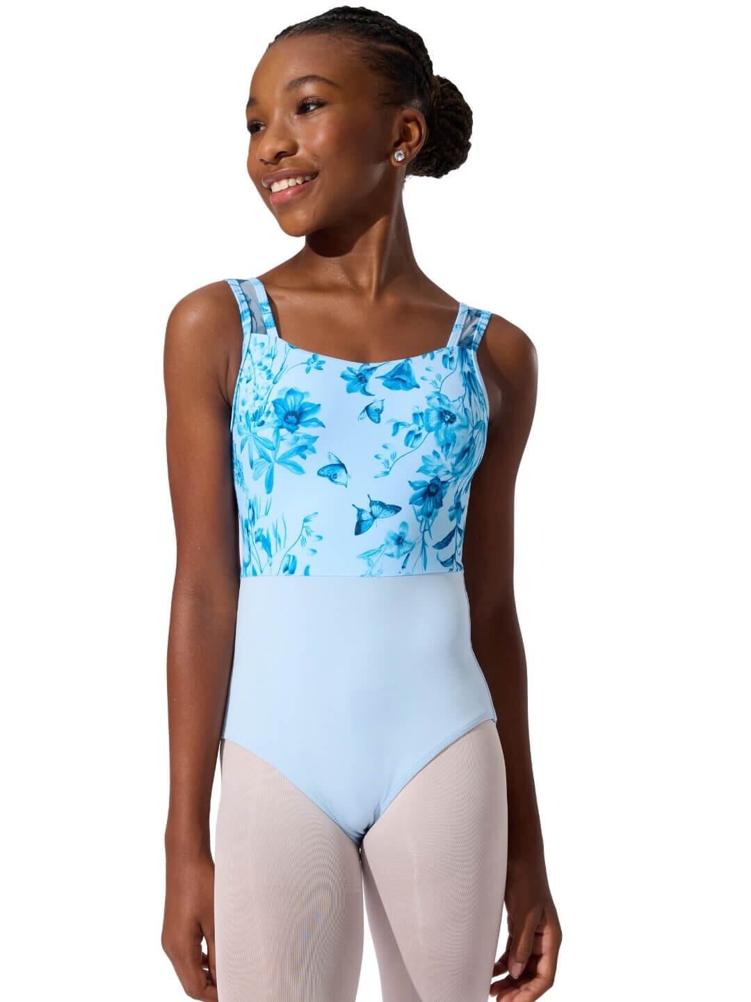 Woman wearing a blue floral leotard with a white background