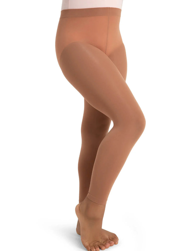 Brown tights worn by a person on a white background