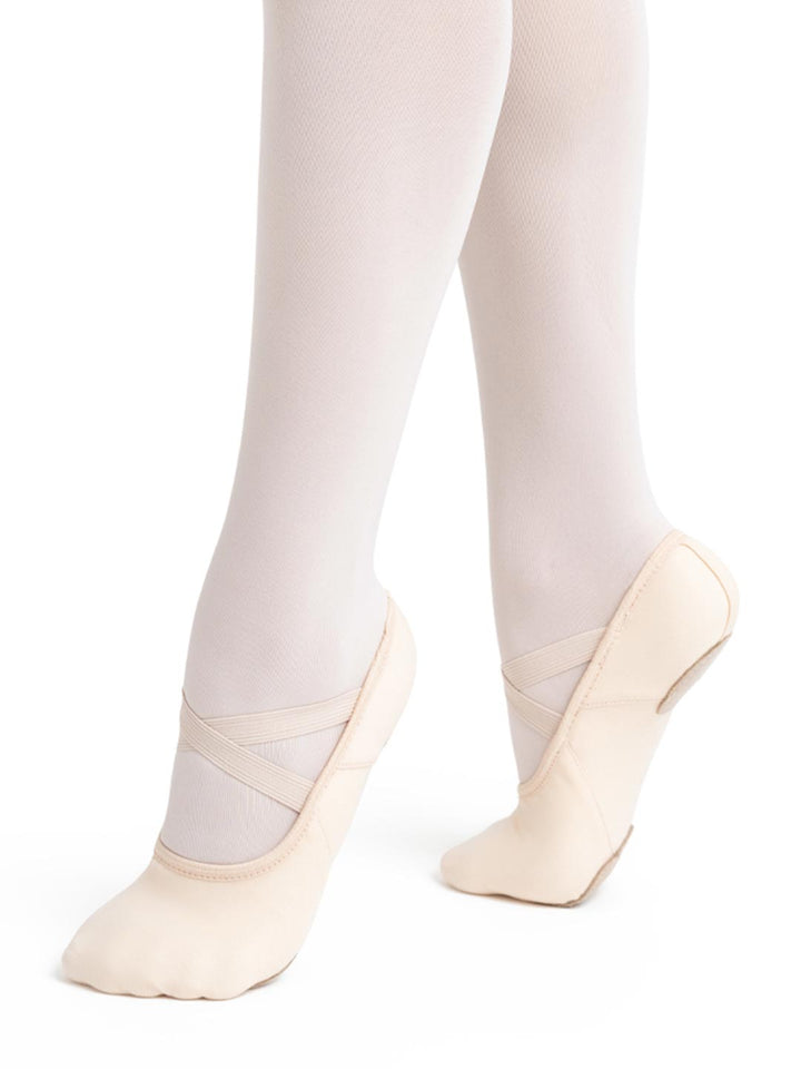 White tights with beige ballet shoes on a white background