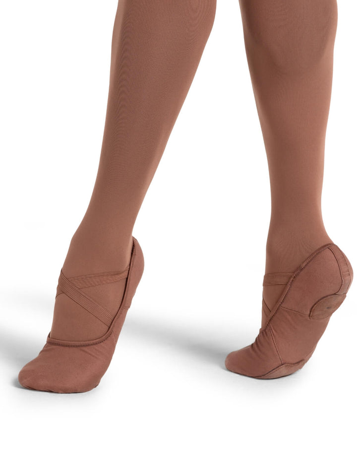 Brown tights worn by a person on a white background