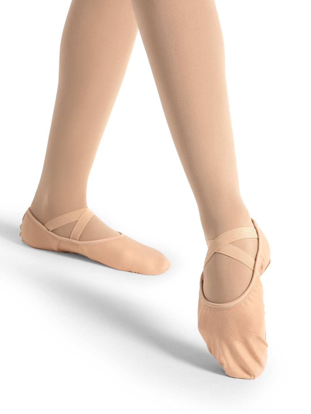 Ballet shoes worn on a white background