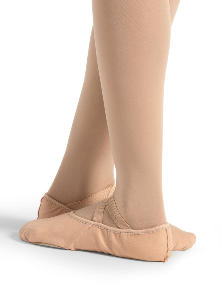 Ballet shoes and tights on a white background
