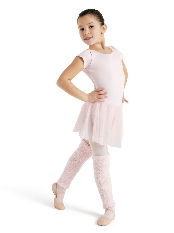 Young girl in a pink ballet outfit on a white background