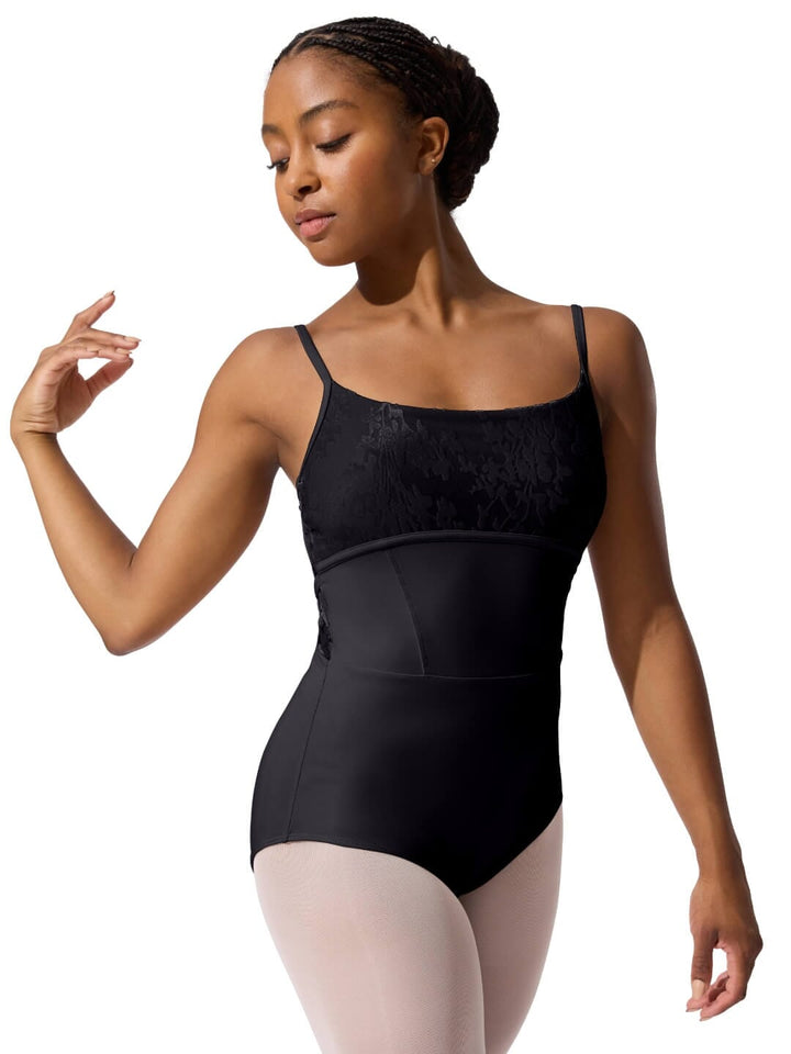 Woman wearing a black leotard on a white background