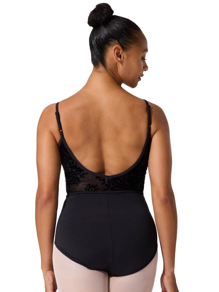Black leotard worn by a model on a white background