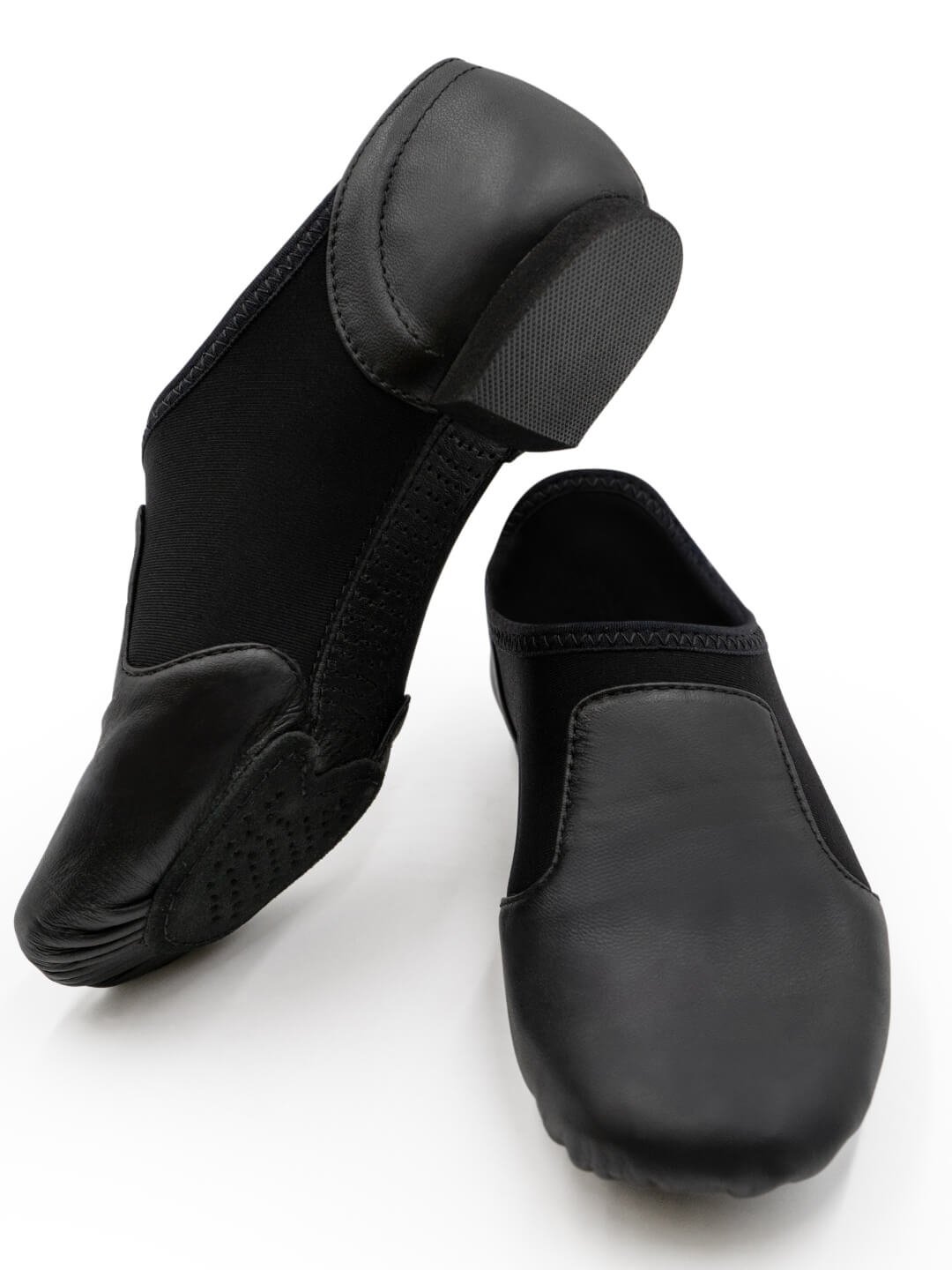 Pair of black dance shoes on a white background
