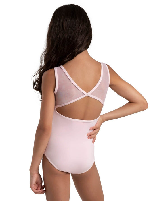 Woman wearing a light pink bodysuit with mesh panels on a white background