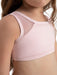 Pink sports bra with mesh panels worn by a person