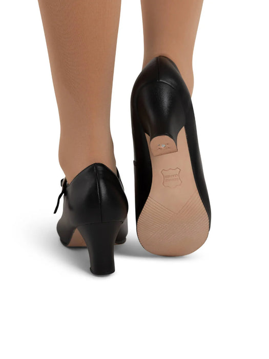 Black shoes with a beige sole on a white background