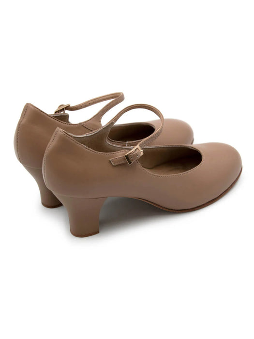 Pair of brown shoes with a strap on a white background