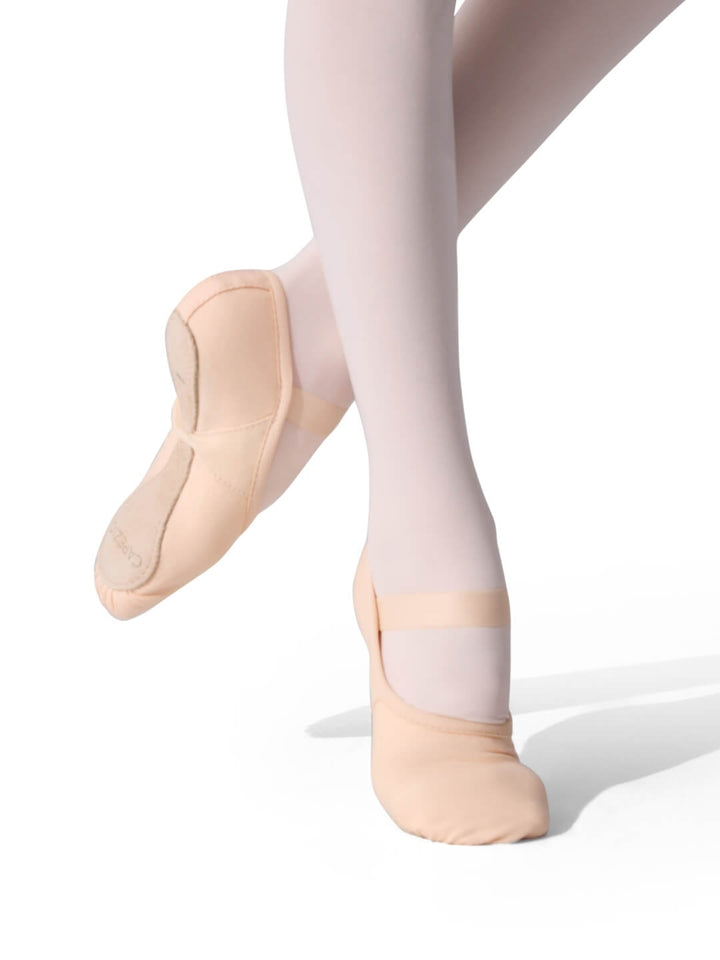 Ballet shoes and tights on a white background