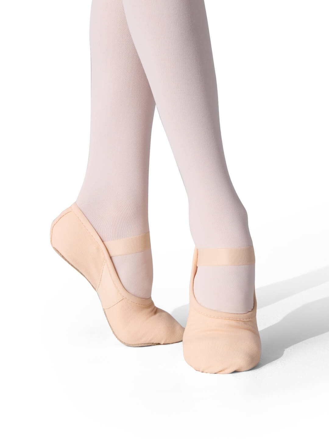 Ballet shoes and tights on a white background