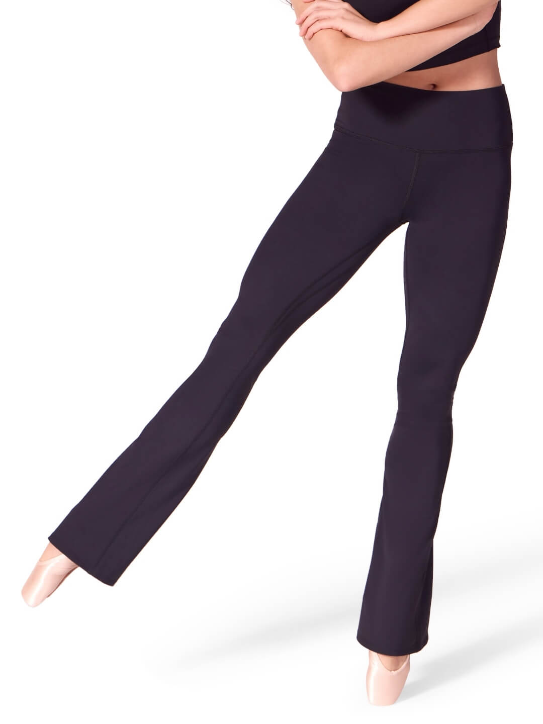 Navy blue leggings worn by a dancer on a white background