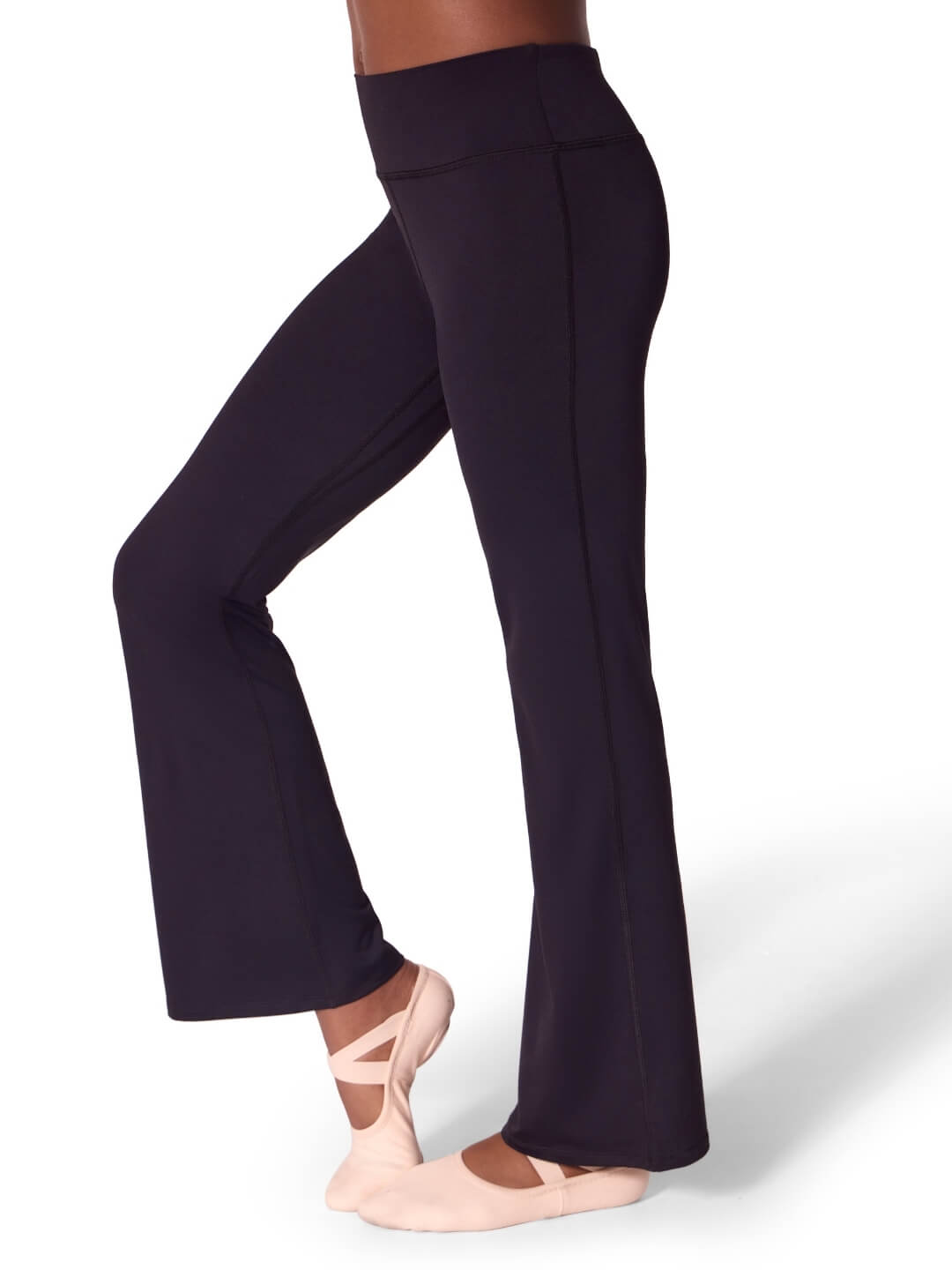 Navy blue leggings worn by a dancer on a white background
